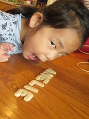 Amelie playing with Schoolhouse Cookies.