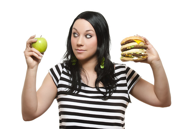 woman with apple and burger