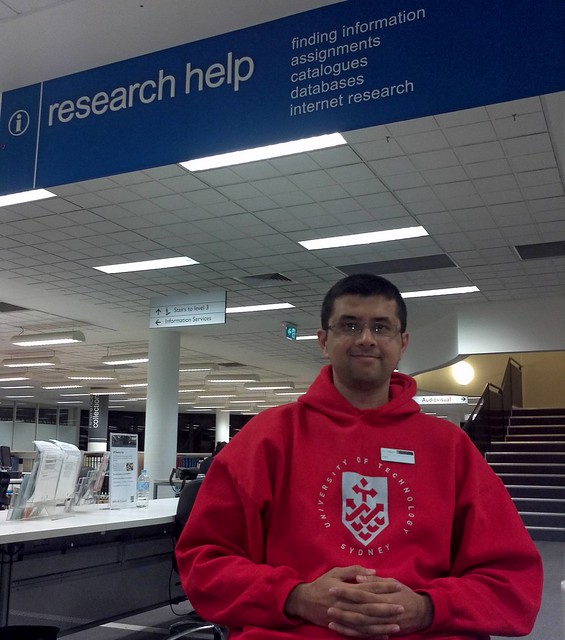 UTS Librarian in Charge - Research Helpdesk Winter Night Shift Wearing Red Hoody