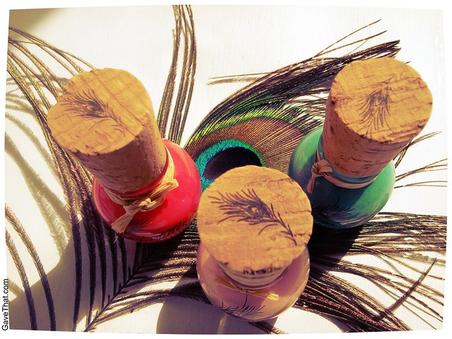 Megan Miller nail polish with lovely peacock feather plumes stamped on the wine cork handles