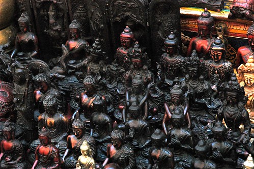 Dozens of Black Buddhas in many mudras and Bodhisattvas, statues, panels, on display for sale, Thamel, Kathmandu, Nepal by Wonderlane