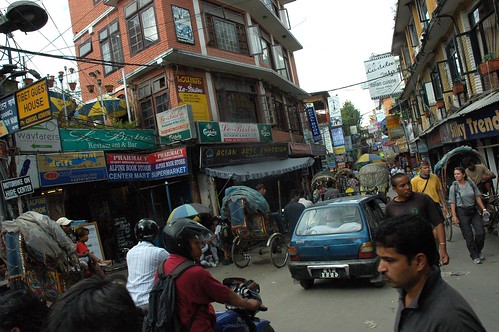 Packed downtown Kathmandu, vehicles, people, signs, buildings, Nepal by Wonderlane