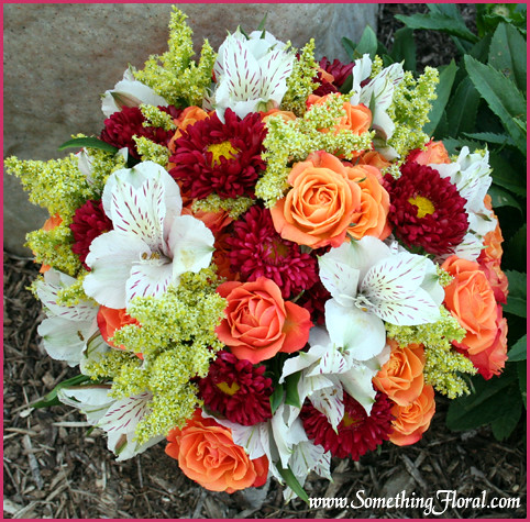 OrangeRedWhiteBouquet A round handtied fresh floral bridal bouquet in 