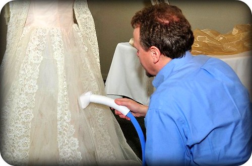 Kevin steams his mother's wedding dress in preparation for their 50th 