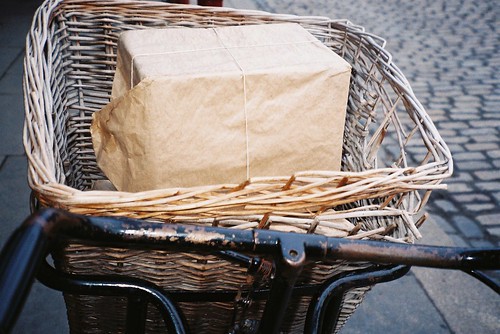 brown paper packages by bicycle