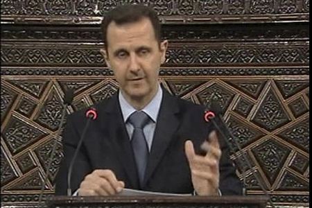 Syrian President Bashar Al-Assad delivers a speech to the parliament in Damascus. The president said that there was a foreign plot against the government and that reforms can be instituted. by Pan-African News Wire File Photos