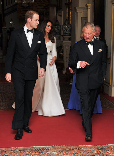 Evening wedding reception The Prince of Wales walks with The Duke of