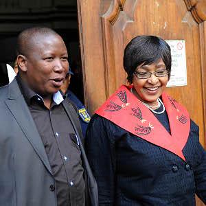 African National Congress Youth League leader Julius Malema and ANC MP Winnie Mandela leaving the Guateng court where Malema was being accused of increasing racial tensions by singing revolutionary songs from the days of the armed struggle in South Africa by Pan-African News Wire File Photos