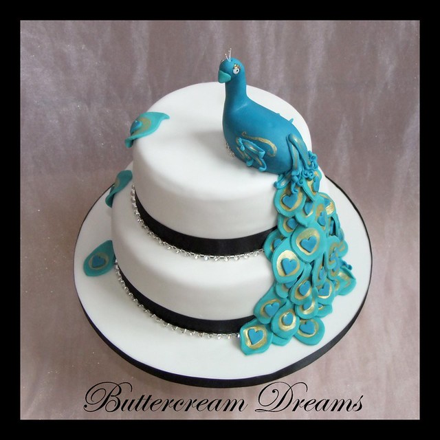 Peacock wedding cake 8 and 6 chocolate cakes iced in white with black 