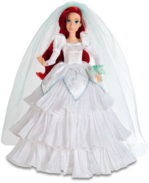 She looks beautiful in her sparkly wedding gown and flowing red hair