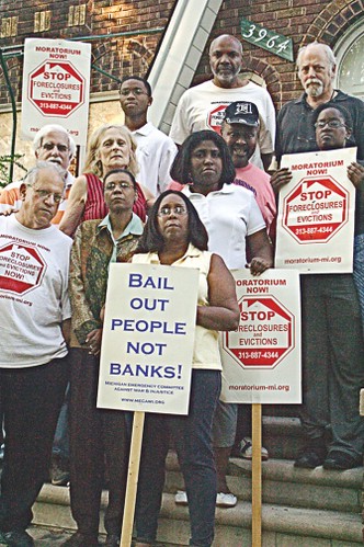 Members of the Moratorium NOW! Coalition to Stop Foreclosures, Evictions and Utility Shut-offs along with the People Before Banks, stand in front of vacant home in East English Village in Detroit. (Photo: W. Kim Heron) by Pan-African News Wire File Photos