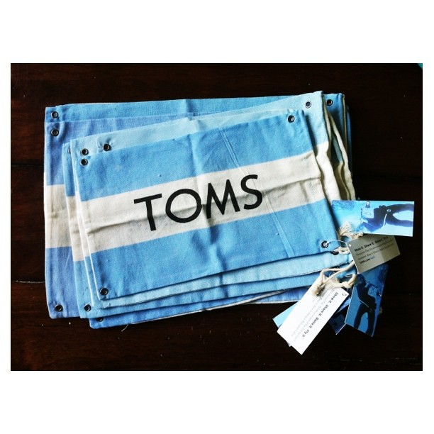 Friends who bring you bunches of TOMS flags are good friends, indeed! | who's up for a TOMS Pouch Sale? | $23 includes US shipping | your pouch will measure 5x7 or larger. | leave your paypal addy to claim one {or three!} | THANK YOU for supporting my fam