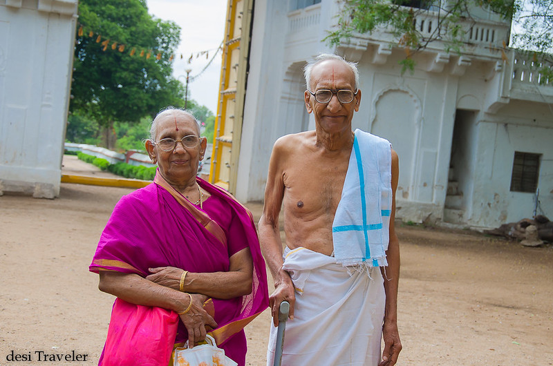 An old south indian couple arriving at sitaram bagh temple