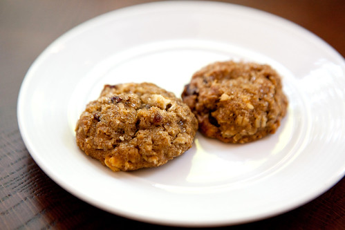 Mini oatmeal cherry and white chocolate cookies served with the check