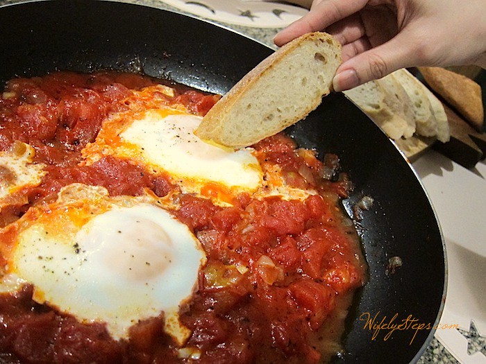 Dip bread into the runny egg.