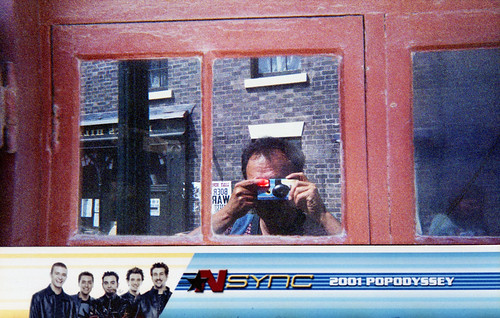 reflected self-portrait with *NSYNC camera and boy band border by pho-Tony