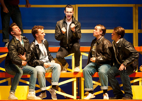 Danny and the gang on the bleachers in the Stage Experience production of Grease at the Edinburgh Playhouse. Photo credit: <a href=