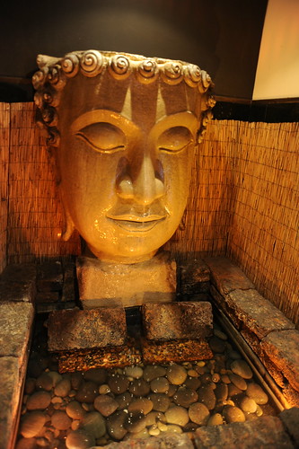 Statue of Buddha's head, like a greek god, fountain, hotel entrance hall alcove, Hotel Valencia, San Jose, California, USA by Wonderlane