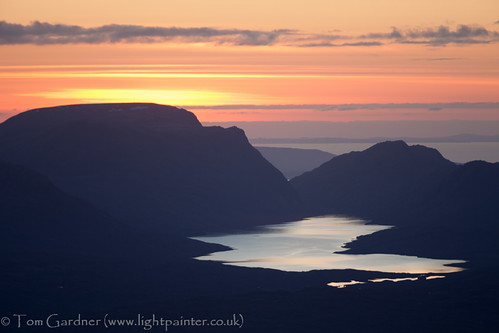 Sunset over Lochan Fada and Slioch from the top of Fionn Bheinn by tomgardner