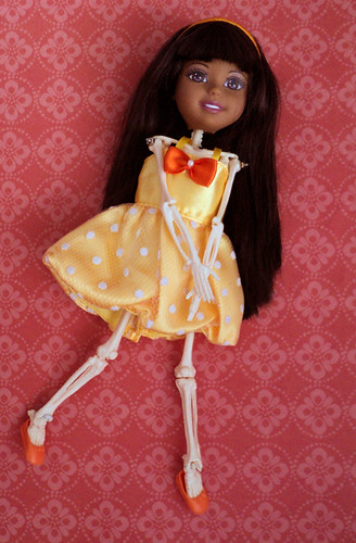 skeletal Black Ana in a yellow dress