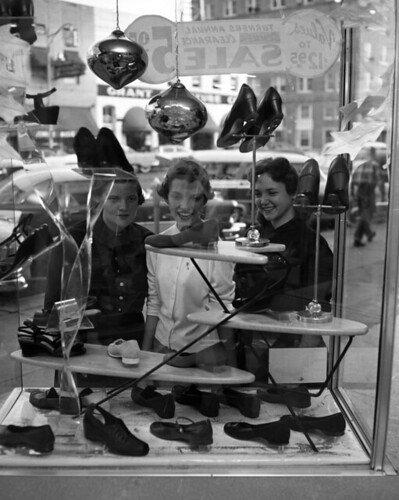 Unidentified young women window shopping at Turner's store in Tallahassee, Florida