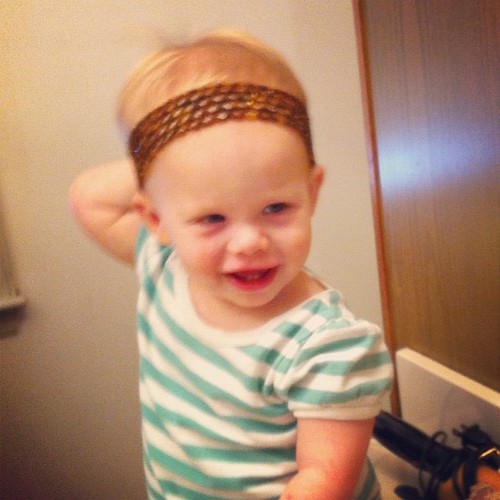 Lucy models Mommy's headband.