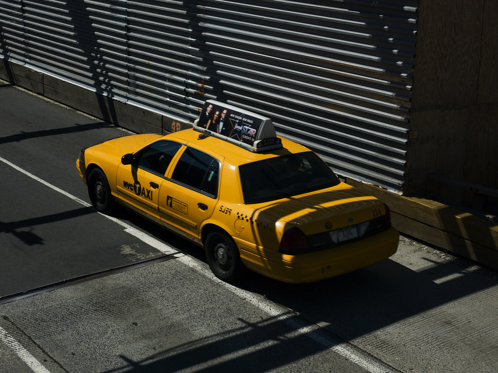 Taxi on Brooklyn Bridge during repair work.