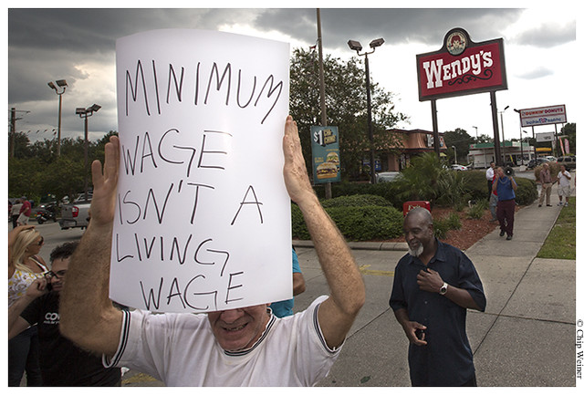 Tom Filbert who is currently unemployed demonstrates for higher wages for fast food workers