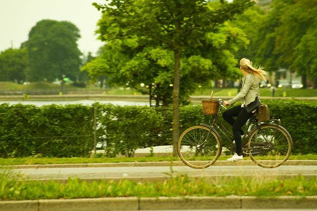 Girl Cycling By the Lakes