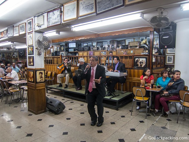 A tango singer performs inside Salon Malaga