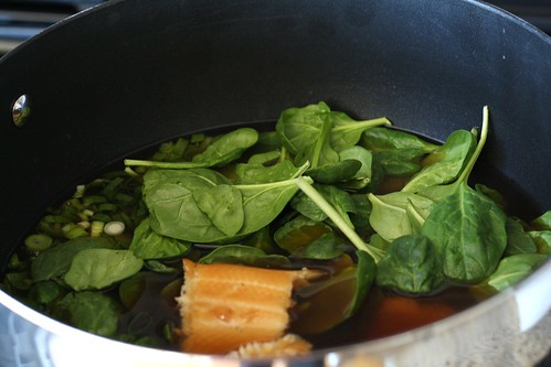 Steep the broth, spinach, trout, and onions