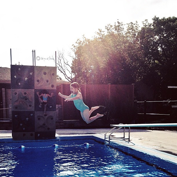 Summer time!!! First trip to the neighborhood pool and she's graduated to the diving board!