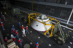 Orion capsule is loaded aboard USS Arlington.
