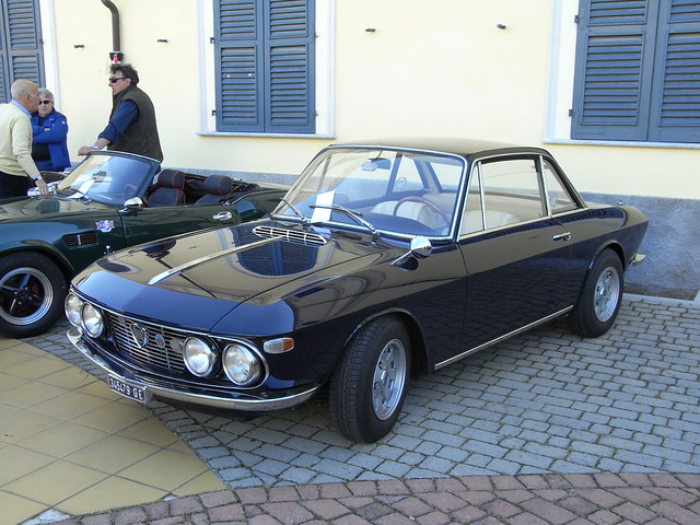 An elegant Lancia Fulvia Coupe at a classic car meeting in Bistagno