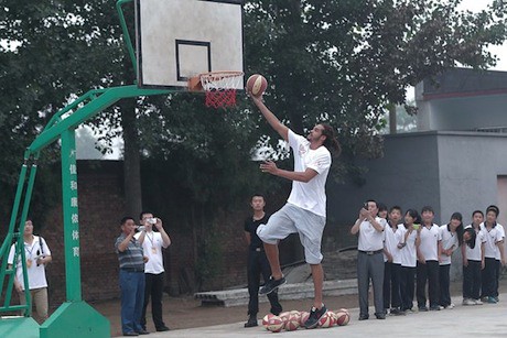 June 30th, 2012 - Joakim Noah puts up a shot at primary school for children of migrant workers at Changping District in Beijing