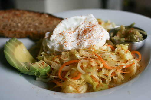 Poached egg with sauteed cabbage, carrots and paprika