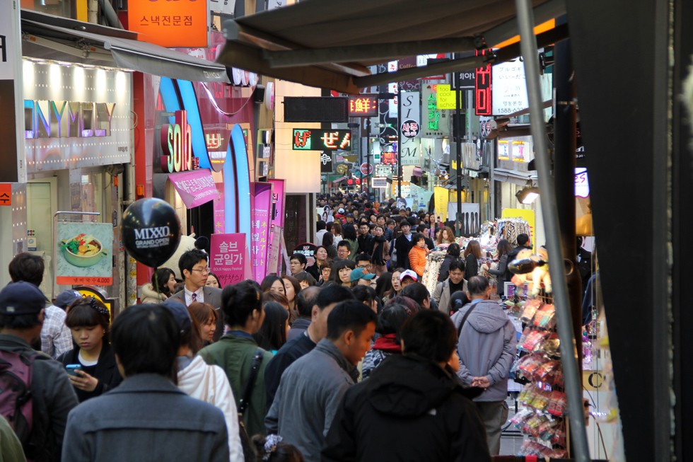 Crowds of shoppers and walkers in Myeongdong, Seoul, South Korea