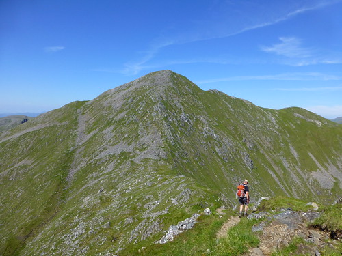 Graham on the ridge between Sgurr na Carnach and Sgurr Fhuaran
