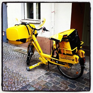 Yellow newspaper bike