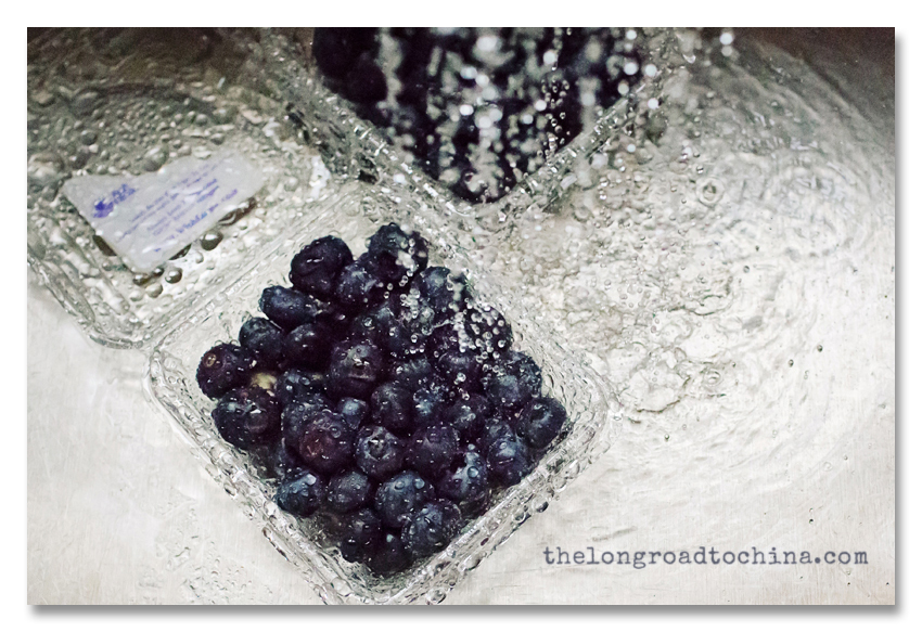 Blueberries in the Stainless Steel Sink with water splashing down BLOG