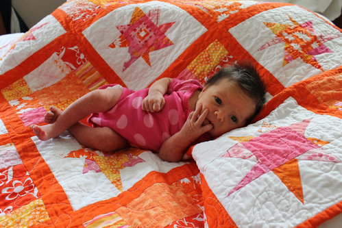 Baby girl and her (guild) quilt by bryanhousequilts