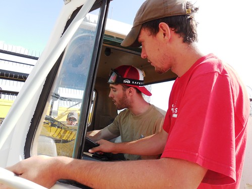 Brandon teaching Graham to drive the service truck