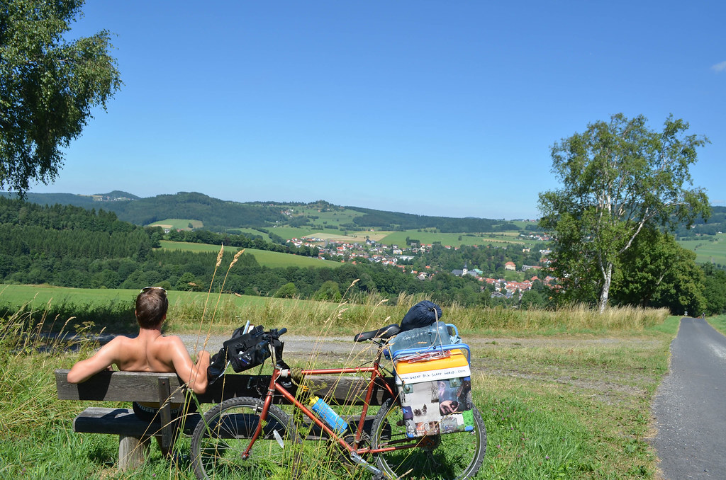 34 relaxing on a bench atop german countryside hills