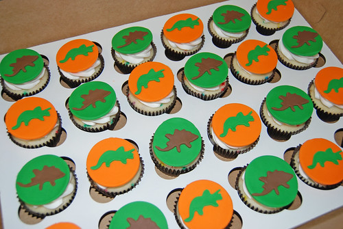 orange brown and green dinosaur cupcakes