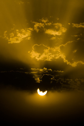 Sun behind the clouds