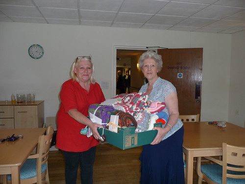 A member of Staff receiving the Blankets (10).