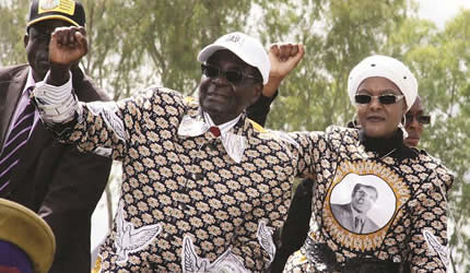Republic of Zimbabwe President Robert Mugabe with First Lady Amai Grace at Nzvimbo High School Rally in Chiweshe, Mashonaland on July 11, 2013. by Pan-African News Wire File Photos