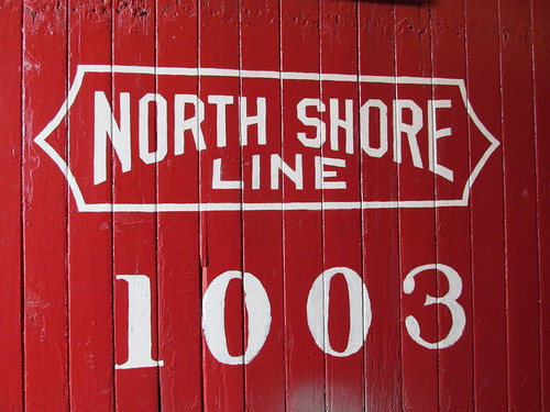 Chicago, North Shore And Milwaukee Railroad stencil markings up close on wooden cupola caboose # 1003.  The Illinois Railway Museum.  Union Illinois.  saturday, May 18th, 2013. by Eddie from Chicago