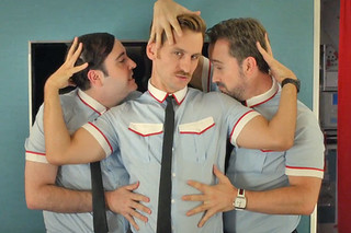 Three male flight attendants stroke eachother