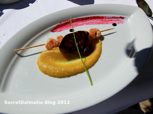 Scampi on apple cream on reduction of monkfish and foie gras
